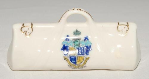 Cricket bags. Five very large crested china cricket bags with colour emblems for &lsquo;Bournemouth&rsquo;, &lsquo;Chesham&rsquo;, &lsquo;Newcastle-on-Tyne&rsquo;, &lsquo;Woolwich&rsquo; and &lsquo;Santa Cruz de Tenerife&rsquo;. Various makers. Each approx 4.5&rdquo; long. G
