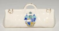 Cricket bags. Five very large crested china cricket bags with colour emblems for &lsquo;Bournemouth&rsquo;, &lsquo;Chesham&rsquo;, &lsquo;Newcastle-on-Tyne&rsquo;, &lsquo;Woolwich&rsquo; and &lsquo;Santa Cruz de Tenerife&rsquo;. Various makers. Each approx 4.5&rdquo; long. G