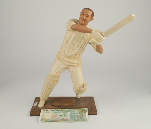 Cricket figures. A large cricket figure of Sir Frank Worrell by Art Edwards and Frances Ross of Barbados, together with a $5 dollar note depicting Worrell and four limited edition Endurance figures of Viv Richards, Ian Botham, Wally Hammond and Garry Sobe