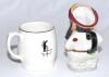 W.G. Grace. Sandland ceramic tankard with transfer printed colour image of Grace in batting pose and and &lsquo;Old Father Time&rsquo; to reverse. Gilt lustre to rim and handle. 4&rdquo; tall. Sold with a Manor potteries china caricature toby jug of Grace in M.C.C. cap. Ap - 2