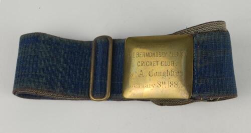 Cricket belt and buckle. Brass cricket full belt and buckle. The brass buckle of oblong design with inscription &lsquo;Presented by The Bermondsey Albion Cricket Team to A. Coughtrey. January 8th 1881. The belt in plain blue cloth. Very good condition. Rare to 
