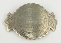 Cricket belt buckle. A large curved Victorian heavily decorated silver belt buckle awarded to John Dorrinton in 1878 for best bowling average. The buckle circular with additional side extensions bearing floral designs. To centre the buckle is inscribed ‘P