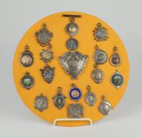 Cricket medals. A lovely selection of nineteen silver medals, all displayed on a circular fabric covered base. The medals, all hallmarked barring one, seem to date from the 1890’s to the 1930’s. Various designs and shapes and odd one with inscriptions to 