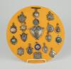 Cricket medals. A lovely selection of nineteen silver medals, all displayed on a circular fabric covered base. The medals, all hallmarked barring one, seem to date from the 1890’s to the 1930’s. Various designs and shapes and odd one with inscriptions to 