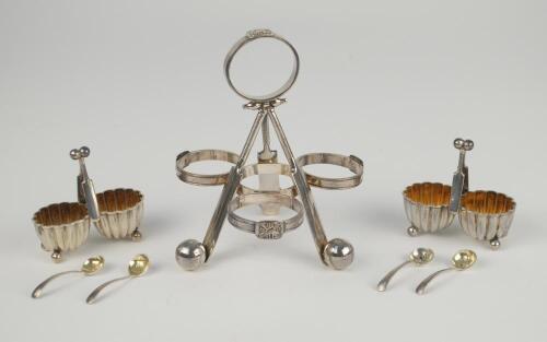 Cricket cruet stand. Edwardian silver plated cruet stand comprising of three crossed cricket bats with cricket ball legs. The handle in the form of a cricketer’s belt and buckle, as are the circular fittings for holding the pots. Approx. 5” high. Lacking 