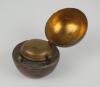 Cricket ball inkwell. Leather cricket ball ink well, well made with seam and stitched quarters. The ball is split and hinged and opens to reveal a brass liner with an original glass ink well. Approximately 2.5” circumference. Some wear to ball otherwise i - 2