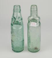 Cricket bottles. Attractive cricket glass lemonade bottles c1870/90’s with ‘Codd’s patent’ glass ‘marble’ ball stop and ‘Rylands Bulb patent’ glass ‘marble’ ball stop. One for ‚ÄòB. Noble of Birstall’ with figure of a batsman, stumps and ball to side of b