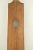 An early presentation cricket bat. An mid to late 19th Century cricket bat from 1874 made by William Page of Dulwich. The bat is slim and slightly humped. The bat is topped by a button cap and is not sprung. There is a silver metal shield to the back of t