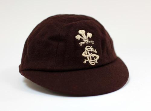 John Berry Hobbs, Surrey & England 1905-1934. Surrey brown county 1st XI cricket cap, by E.C. Devereux of Eton, with silk crest of the Prince of Wales feathers above the county emblem embroidered to front. The inner label inscribed in ink ‘Hobbs’. Odd min