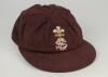 Arnold Long. Surrey and Sussex 1960-1980. Surrey C.C.C. chocolate brown county 1st XI cricket cap by Jack Hobbs Ltd, with crest of the Prince of Wales feathers above the county emblem embroidered to front. Some wear to peak with small hole and some wear, 