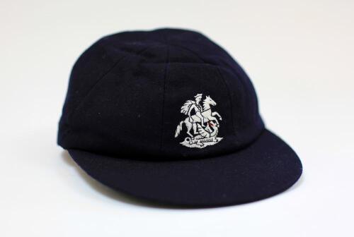 Robert George Dylan Willis. Surrey, Warwickshire & England 1969-1984. M.C.C. navy blue touring cap, by Michael of Chatham, issued to Willis during his Test career. The cap, with England emblem of St. George and the Dragon embroidered to front, has an offi