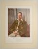 &lsquo;Sir Donald Bradman&rsquo;. Large colour print of a portrait of Bradman, seated three quarter length wearing Australia Test blazer. Printed title to lower border with description, &lsquo;The original was presented to the South Australian Cricket Association by the Tr