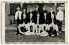 Australian Cricket team 1907/08. Scarce printed mono postcard of the Australian team, standing and seated in rows, wearing blazers with the umpires, Crockett and Hannah, to either side. Players named to top and lower borders. Publisher unknown. Postally u