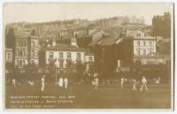 South of England v South Africa, Hastings 1904. Early sepia real photograph postcard of the tour match in progress showing the fall of the first wicket. Title to image ‘Hastings Cricket Festival Sept 1904. South of England v South Africans. Fall of the fi