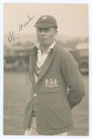 William Legge Neale. Gloucestershire 1923-1948. Original mono real photograph postcard of Neale, three quarter length wearing cricket attire and Gloucestershire cap and blazer. Signed in ink to the photograph by Neale. H.K. Fox of Gloucester. Postally unu