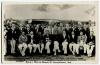 M.C.C. tour of India & Ceylon 1933/34. Real photograph mono joint team postcard of the M.C.C. and Dowlah XI teams and spectators standing and seated on the field in front of a marquee at the Gymkhana Ground, Secunderabad . Handwritten title and players na