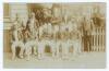 &lsquo;Gloucestershire Cricket Team 1906&rsquo;. Original sepia postcard of the Gloucestershire team seated and standing in rows wearing cricket attire, assorted blazers and headgear. Players featured include Jessop (Captain), Board, Dennett, Ford, Wrathall, Thomas e