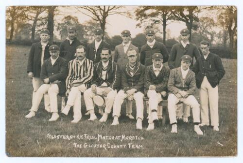 &lsquo;Glostershire [sic] Trial Match at Moreton. The Gloster County Team&rsquo; c.1905. Original mono real photograph postcard of thirteen members of the Gloucestershire team seated and standing in rows wearing cricket attire, caps and assorted blazers. Captain, Gi