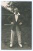 Harry Smith. Gloucestershire & England 1912-1935. Original mono real photograph postcard of Smith standing full length wearing cricket attire and Gloucestershire blazer, hands on hips. Printed title &lsquo;Smith, H.W. [sic]&rsquo; to image. Signed in ink to the photo