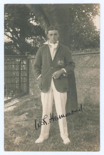 Walter Reginald &lsquo;Wally&rsquo; Hammond. Gloucestershire & England 1920-1951. Excellent original mono real photograph postcard of Hammond standing full length wearing cricket attire and Gloucestershire blazer, cigarette in hand. Very nicely signed in black ink by