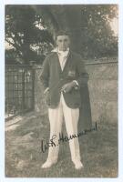 Walter Reginald ‘Wally’ Hammond. Gloucestershire & England 1920-1951. Excellent original mono real photograph postcard of Hammond standing full length wearing cricket attire and Gloucestershire blazer, cigarette in hand. Very nicely signed in black ink by