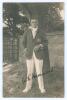 Walter Reginald &lsquo;Wally&rsquo; Hammond. Gloucestershire & England 1920-1951. Excellent original mono real photograph postcard of Hammond standing full length wearing cricket attire and Gloucestershire blazer, cigarette in hand. Very nicely signed in black ink by