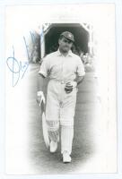 Denis Neville Moore. Gloucestershire & Oxford University 1930-1936. Original mono real photograph plain back postcard of Moore in cameo, full length walking out to bat at Scarborough. Signed in blue ink by Moore to the image, and again to the verso. Offic