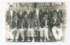 Hampshire C.C.C. 1914. Original mono real photograph plain back postcard of the 1914 Hampshire team seated and standing in rows wearing cricket attire, caps and blazers. Ex John Arlott collection with title and players’ names neatly annotated in Arlott’s 