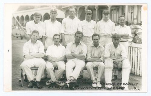 Hampshire C.C.C. 1921. Original mono real photograph plain back postcard of the 1921 Hampshire team seated and standing in rows wearing cricket attire and some caps in front of the pavilion. Ex John Arlott collection with title and players’ names neatly a