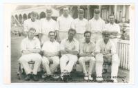 Hampshire C.C.C. 1921. Original mono real photograph plain back postcard of the 1921 Hampshire team seated and standing in rows wearing cricket attire and some caps in front of the pavilion. Ex John Arlott collection with title and players’ names neatly a