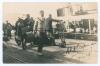 Arthur Percy Frank Chapman. Cambridge University, Kent & England 1920-1938. Original sepia real photograph postcard of Chapman wearing a cricket sweater, and carrying luggage about to board a ship, followed by a similarly burdened porter. Signed in ink to