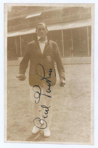 Cecil Harry ‘Cec’ Parkin. Yorkshire, Lancashire & England 1906-1926. Early sepia real photograph postcard of Parkin depicted full length on the field, pavilion in the background, wearing cricket attire and M.C.C. touring blazer. Very nicely signed in ink 