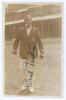 Cecil Harry ‘Cec’ Parkin. Yorkshire, Lancashire & England 1906-1926. Early sepia real photograph postcard of Parkin depicted full length on the field, pavilion in the background, wearing cricket attire and M.C.C. touring blazer. Very nicely signed in ink 