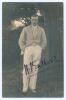 Henry John ‘Tom’ Enthoven. Cambridge University & Middlesex 1923-1936. Early mono real photograph postcard of Enthoven standing full length under a tree wearing cricket attire and (probably Cambridge) blazer. Boldly and nicely signed in ink to the photogr