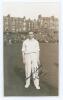 Robert Walter Vivian Robins. Middlesex, Cambridge University & England 1926-1951. Mono real photograph postcard of Robins standing full length on the field at Scarborough with crowded stands in the background. Signed in black ink to the photograph by Robi