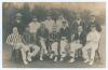 Northamptonshire C.C.C. 1907. Early mono real photograph postcard of the Northamptonshire team seated and standing in rows wearing assorted blazers and headgear. Players’ names and other annotations to verso. Players featured include Crosse (Captain), Via