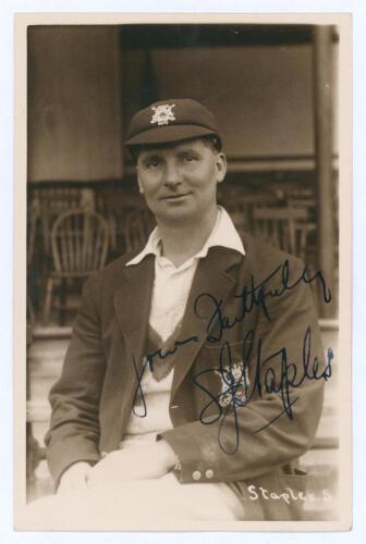 Samuel James &lsquo;Sam&rsquo; Staples. Nottinghamshire & England 1920-1934. Early sepia real photograph postcard of Staples seated half length on pavilion steps, wearing Nottinghamshire cap and blazer. C.H. Richards of Nottingham. Very nicely signed in ink to the ph