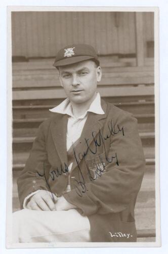 Ben Lilley. Nottinghamshire 1921-1937. Early sepia real photograph postcard of Lilley seated half length on pavilion steps, wearing Nottinghamshire cap and blazer. C.H. Richards of Nottingham. Nicely signed in ink to the photograph by Lilley. Postally unu