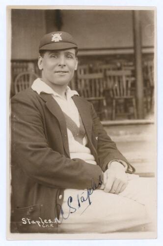 Arthur Staples. Nottinghamshire 1924-1938. Early sepia real photograph postcard of Staples seated half length on pavilion steps, wearing Nottinghamshire cap and blazer. C.H. Richards of Nottingham. Nicely signed in ink to the photograph by Staples. Postal
