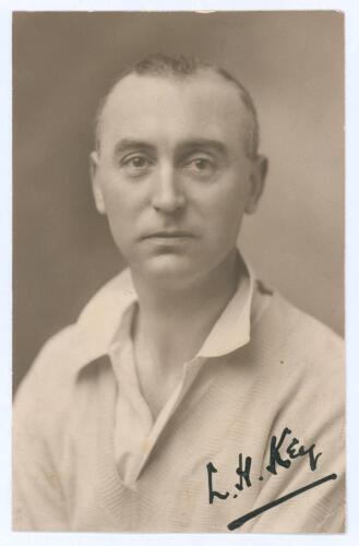Laurence Henry Key. Somerset 1919-1922. Early sepia real photograph postcard of a studio portrait of Key, head and shoulders, wearing cricket attire. Nicely signed in black ink to the photograph by Key. Cyril Sledmere, Taunton. Adhesive marks to verso whe