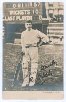 Robert ‘Bobby’ Abel. Surrey & England 1881-1904. Early sepia real photograph postcard of Abel standing full length in front of the scoreboard, wearing cricket attire, leaning on his bat. The scoreboard depicts Abel’s highest first-class score of 357no whe