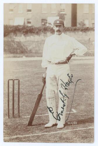 Ernest George &lsquo;Ernie&rsquo; Hayes. Surrey, Leicestershire & England 1896-1926. Sepia real photograph postcard of Hayes standing full length at the wicket wearing cricket attire and Surrey cap, leaning on his bat. Very nicely signed in black ink to image by Haye