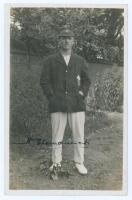 Herbert Strudwick. Surrey & England 1902-1927. Early mono real photograph postcard of Strudwick standing full length wearing cricket attire and Surrey cap and blazer. Very nicely signed in black ink to the photograph by Strudwick. Blind embossed stamp to 