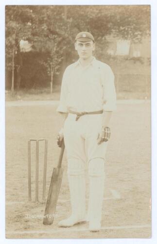 John Neville &lsquo;Jack&rsquo; Crawford. Surrey, South Australia & England 1904-1921. Early sepia real photograph postcard of Crawford standing full length at the wicket wearing cricket attire and Surrey cap, leaning on his bat. Foster of Brighton. Postally unused. 