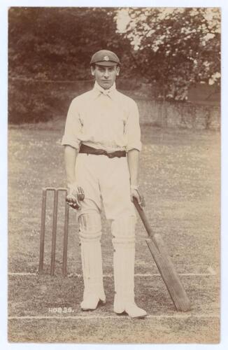 John Berry &lsquo;Jack&rsquo; Hobbs. Surrey & England 1905-1934. Excellent early sepia real photograph postcard of a youthful Hobbs standing full length at the wicket wearing cricket attire and Surrey cap, leaning on his bat. Foster of Brighton. Postally unused. A lo