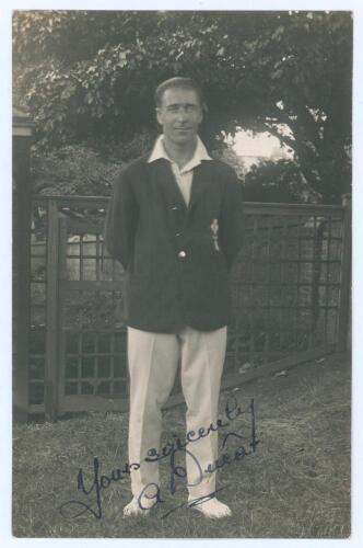 Andrew &lsquo;Andy&rsquo; Ducat. Surrey & England 1906-1931. Early mono real photograph postcard of Ducat standing full length wearing cricket attire and Surrey blazer. Very nicely signed in ink to the photograph by Ducat. Blind embossed stamp to lower left corner fo