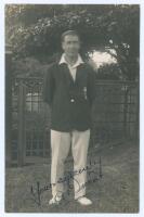 Andrew ‘Andy’ Ducat. Surrey & England 1906-1931. Early mono real photograph postcard of Ducat standing full length wearing cricket attire and Surrey blazer. Very nicely signed in ink to the photograph by Ducat. Blind embossed stamp to lower left corner fo