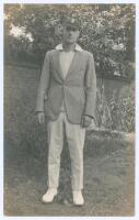 Edward William John ‘Ted’ Brooks. Surrey 1925-1939. Original mono real photograph postcard of a youthful Brooks standing full length, wearing blazer and Surrey cap. Nias of Brighton with official stamp for A.G. Spalding & Bros., Brighton and Hove to verso