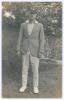 Edward William John &lsquo;Ted&rsquo; Brooks. Surrey 1925-1939. Original mono real photograph postcard of a youthful Brooks standing full length, wearing blazer and Surrey cap. Nias of Brighton with official stamp for A.G. Spalding & Bros., Brighton and Hove to verso