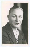 Gerald Spencer Mobey. Surrey 1930-1948. Original mono real photograph postcard of Mobey, head and shoulders wearing cricket attire and blazer. Nicely signed in ink to the photograph by Mobey. Official stamp to verso for A. Wilkes & Son, West Bromwich and 